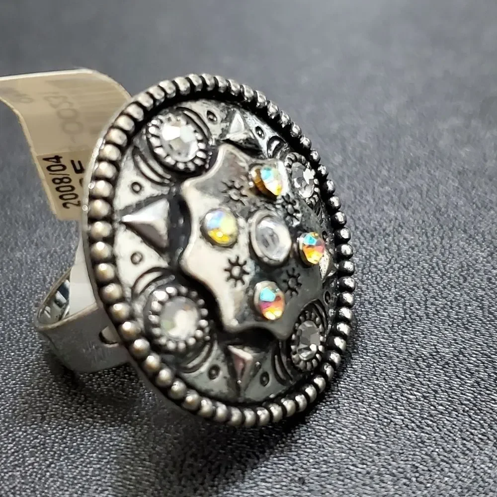 Silver tone circular sparkly ring